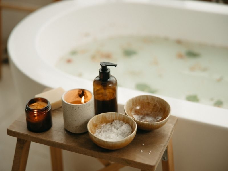Relaxing Spa Setup with Candles and Bath Salts