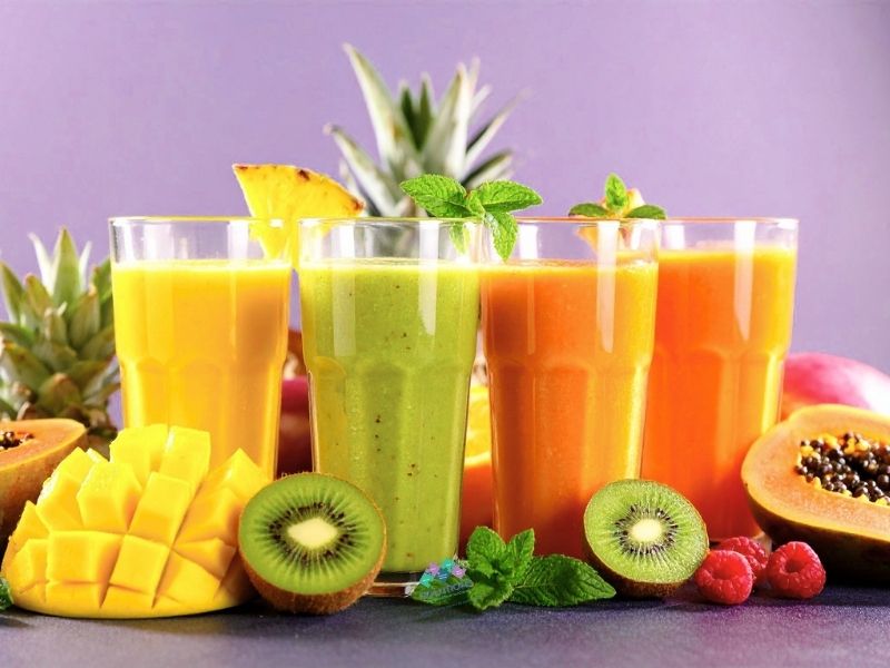 four smoothies different fruits