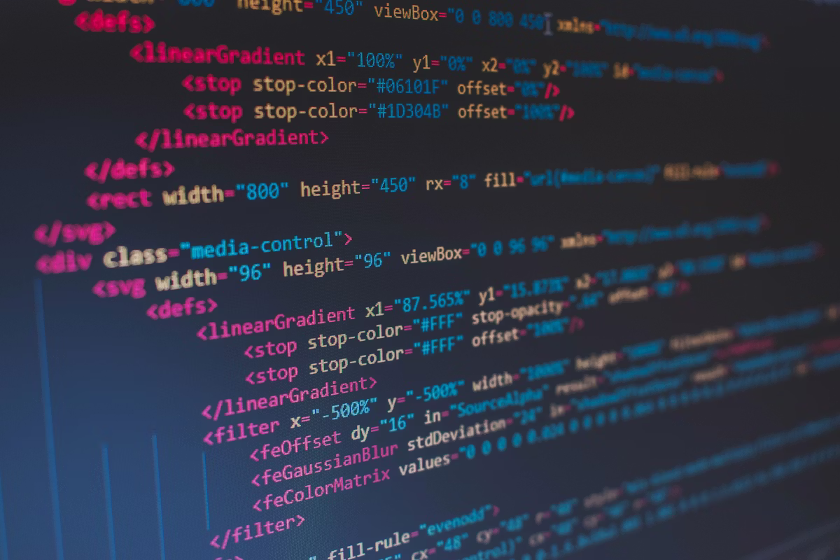 Colorful software code on a screen representing SaaS, OEM agreements, and technology transfer