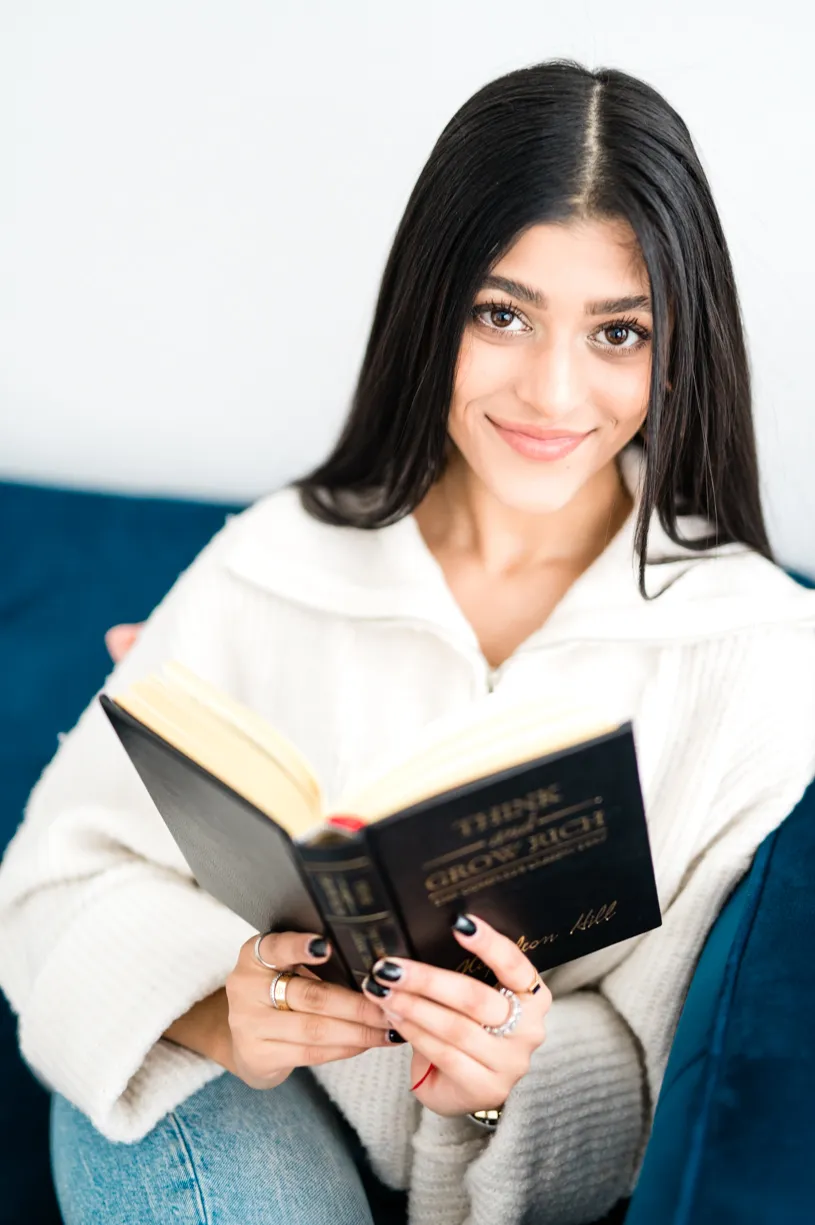 Amber Farooqui reading a book
