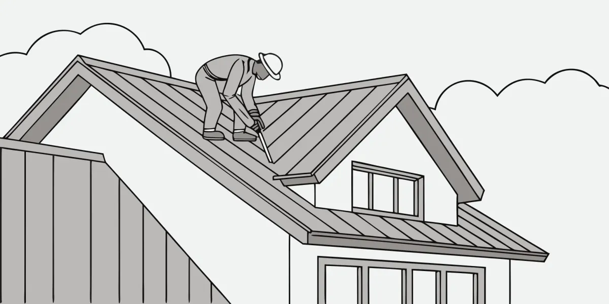 Contractor installing new panels during a metal roof replacement.