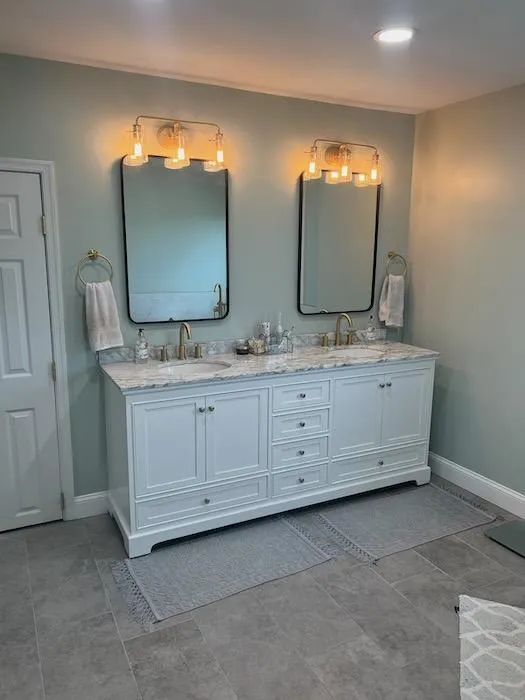 Two washbasins with mirrors