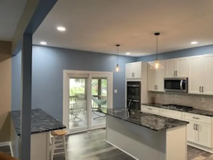 A kitchen with a glass door