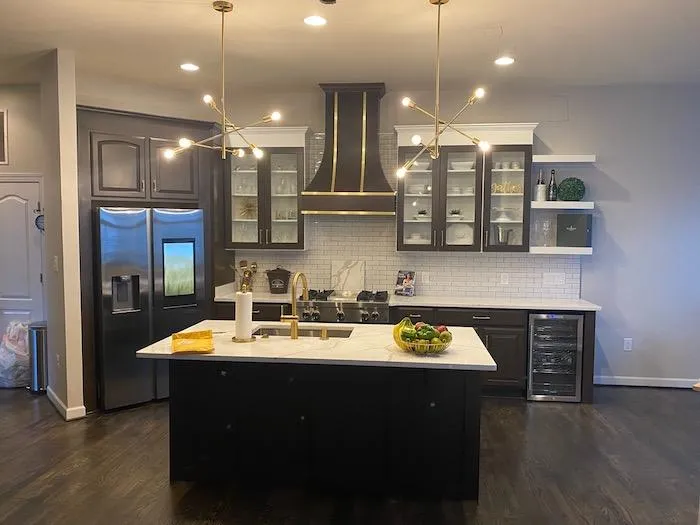 Kitchen with stainless steel refrigerator  a kitchen with a marble island and stainless steel appliances