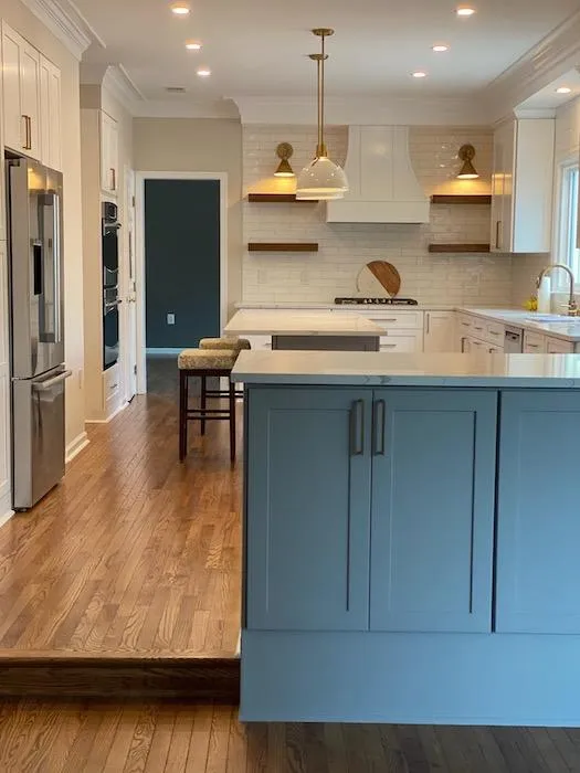 a kitchen with a wood floor and an island