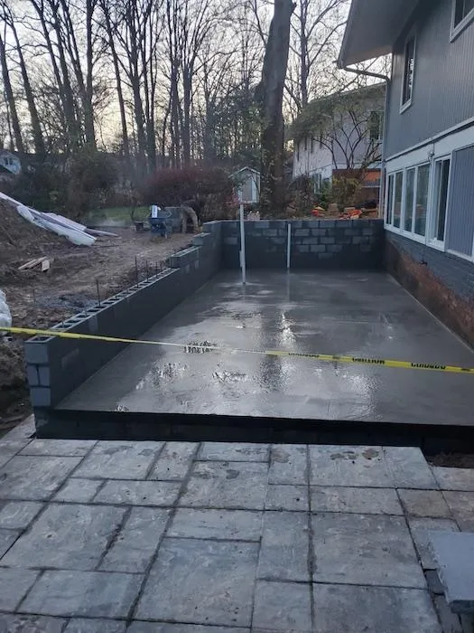 a concrete foundation with a yellow tape