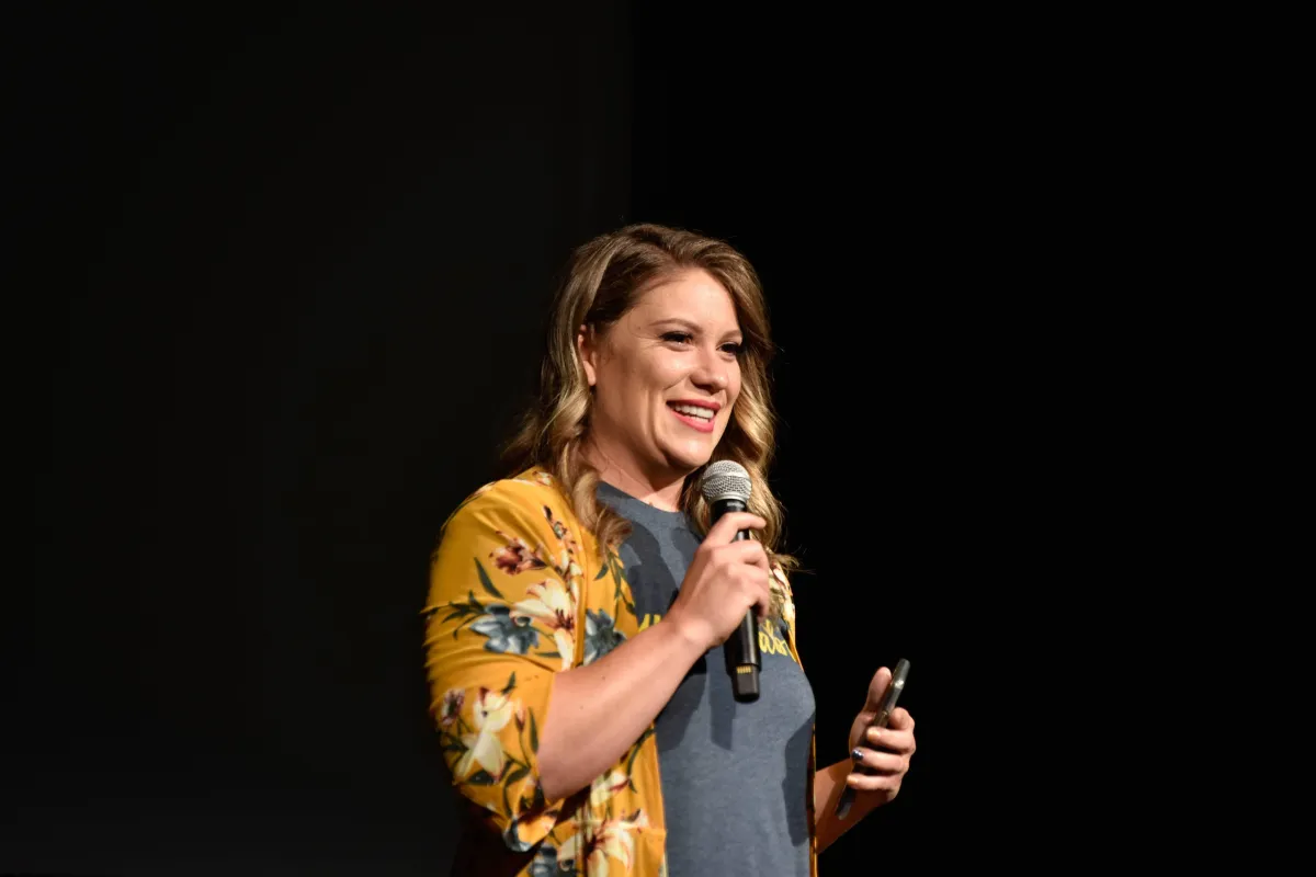 low-angle photography of man in the middle of buidligns