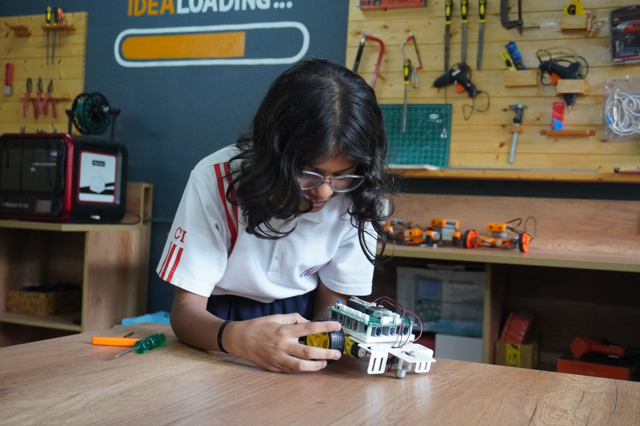 Students working together at a hands-on session in a school lab