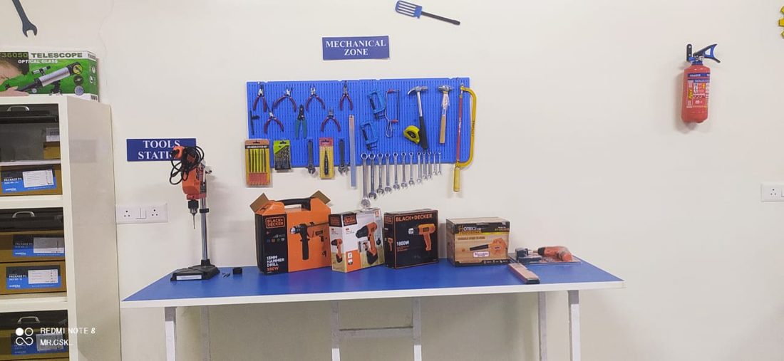 Tool station in a school STEM lab with hand tools and build materials