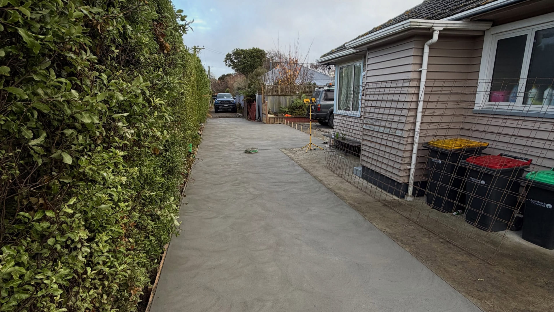 Coloured concrete driveway installed for a Christchurch homeowner