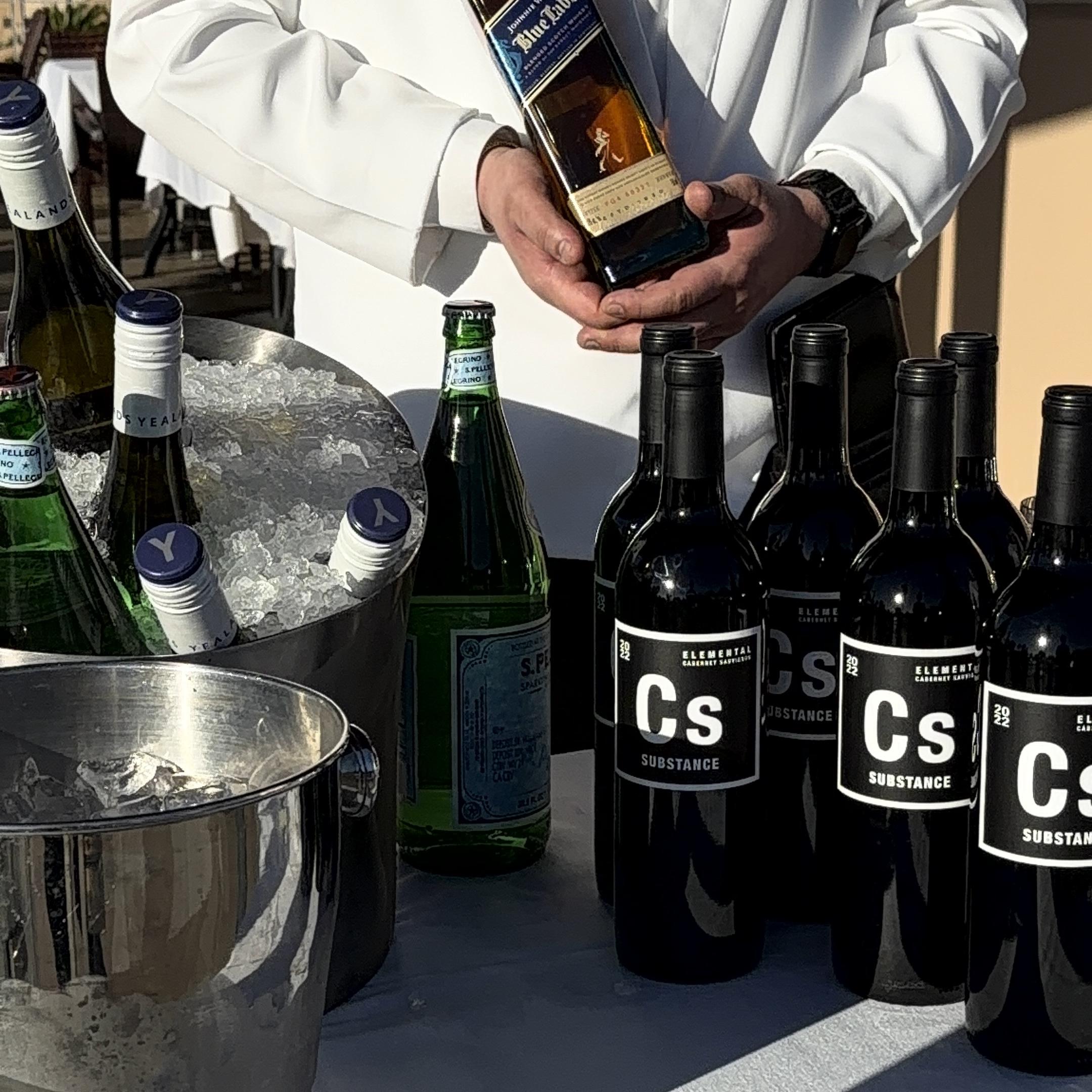 A luxurious hotel room with two beds.