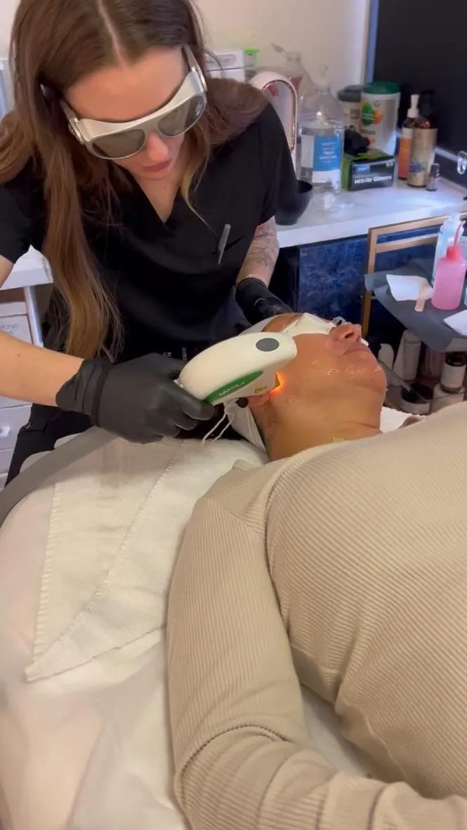 Satisfied medical spa client portrait showing natural results