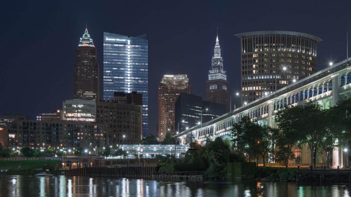 a kitchen with three stools and a center island