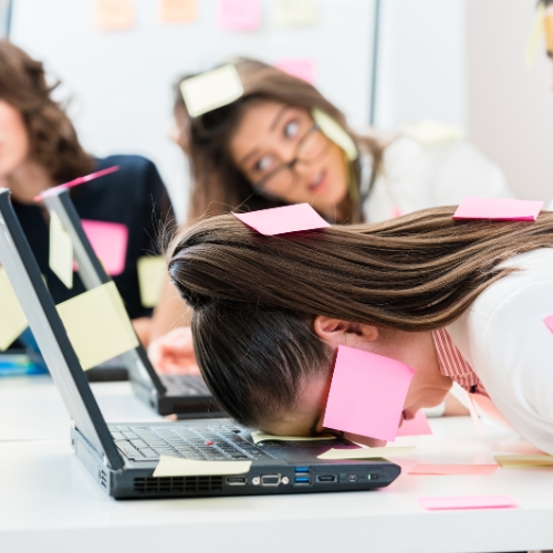 A creative workspace with a marketing strategist sketching campaign ideas on a glass board, surrounded by digital devices and colorful charts, 1:1 aspect ratio