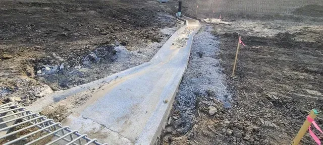 Concrete channel installation on active construction site by Quick Concrete Solutions Central Iowa