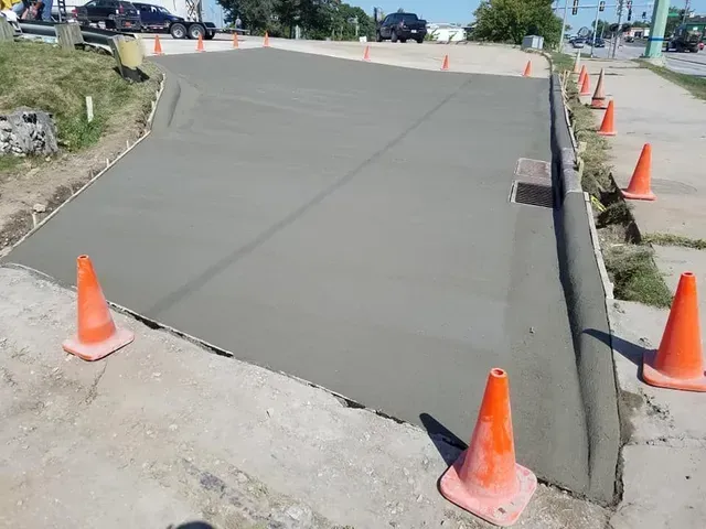 Street intersection concrete repair freshly poured by Quick Concrete Solutions Central Iowa