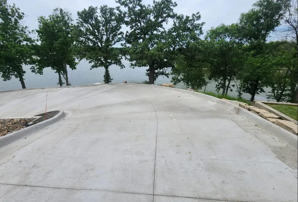Lakefront concrete patio slab installation with water view by Quick Concrete Solutions Iowa