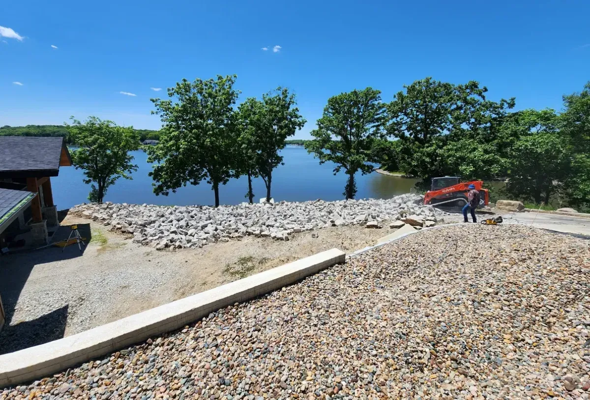 Concrete curb and flatwork installation at lakefront property by Quick Concrete Solutions Iowa