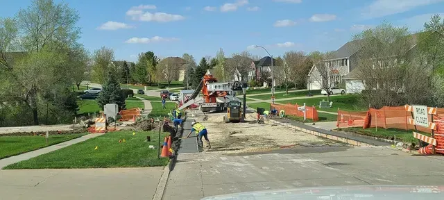 Residential street concrete repair with crew and equipment by Quick Concrete Solutions Central Iowa