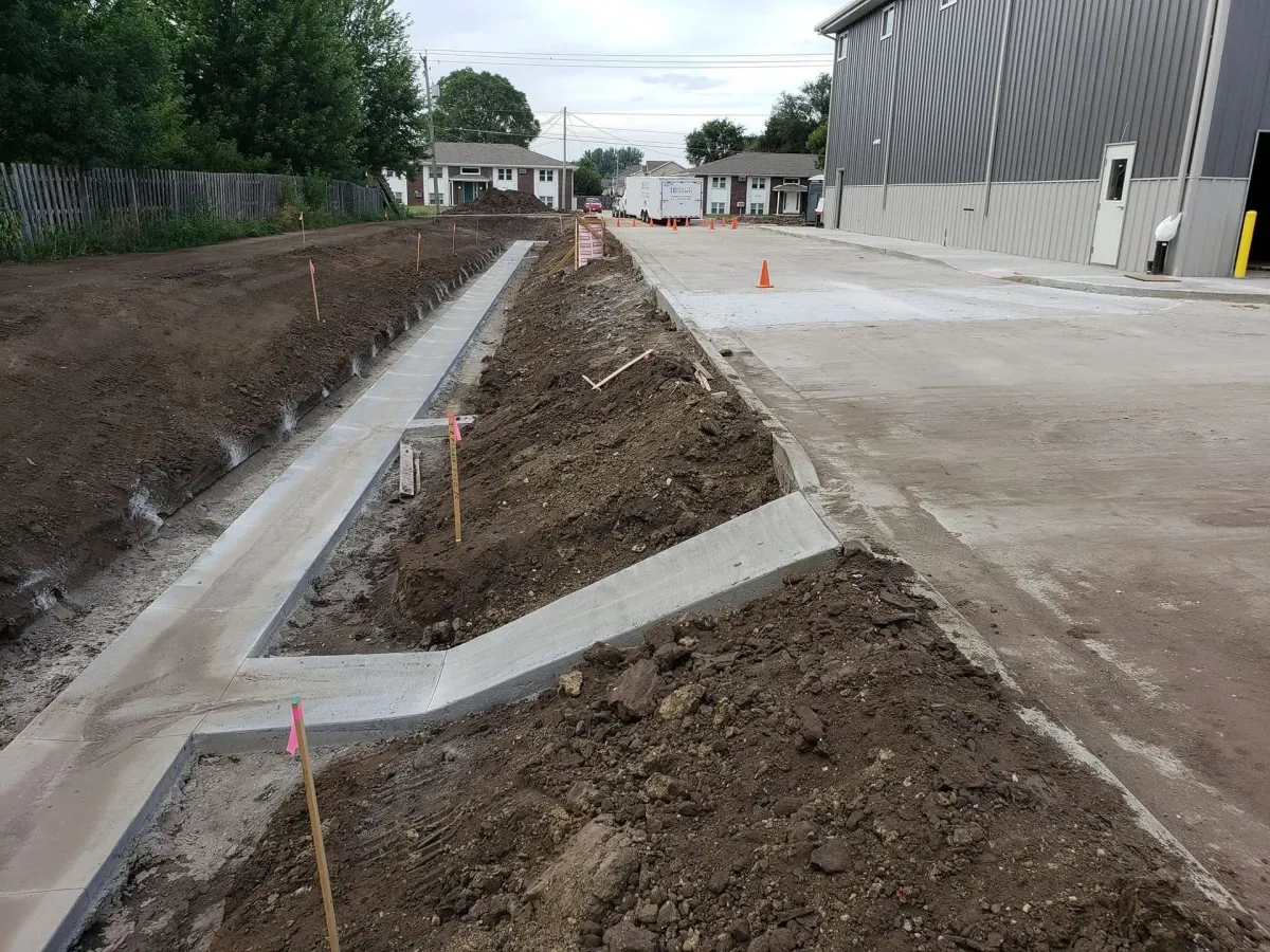 Commercial concrete curb and gutter installation at commercial site by Quick Concrete Solutions Central Iowa