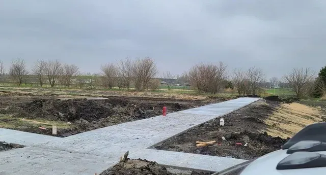 New concrete driveway pour at rural property under construction by Quick Concrete Solutions Iowa