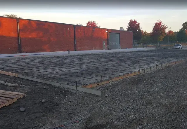 Commercial concrete slab rebar preparation before pour by Quick Concrete Solutions Central Iowa