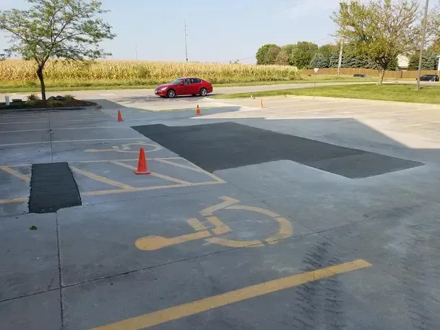 ADA handicap parking space concrete repair and patching by Quick Concrete Solutions Central Iowa