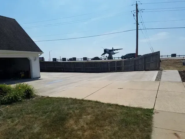 Residential concrete driveway installation near Iowa military base by Quick Concrete Solutions