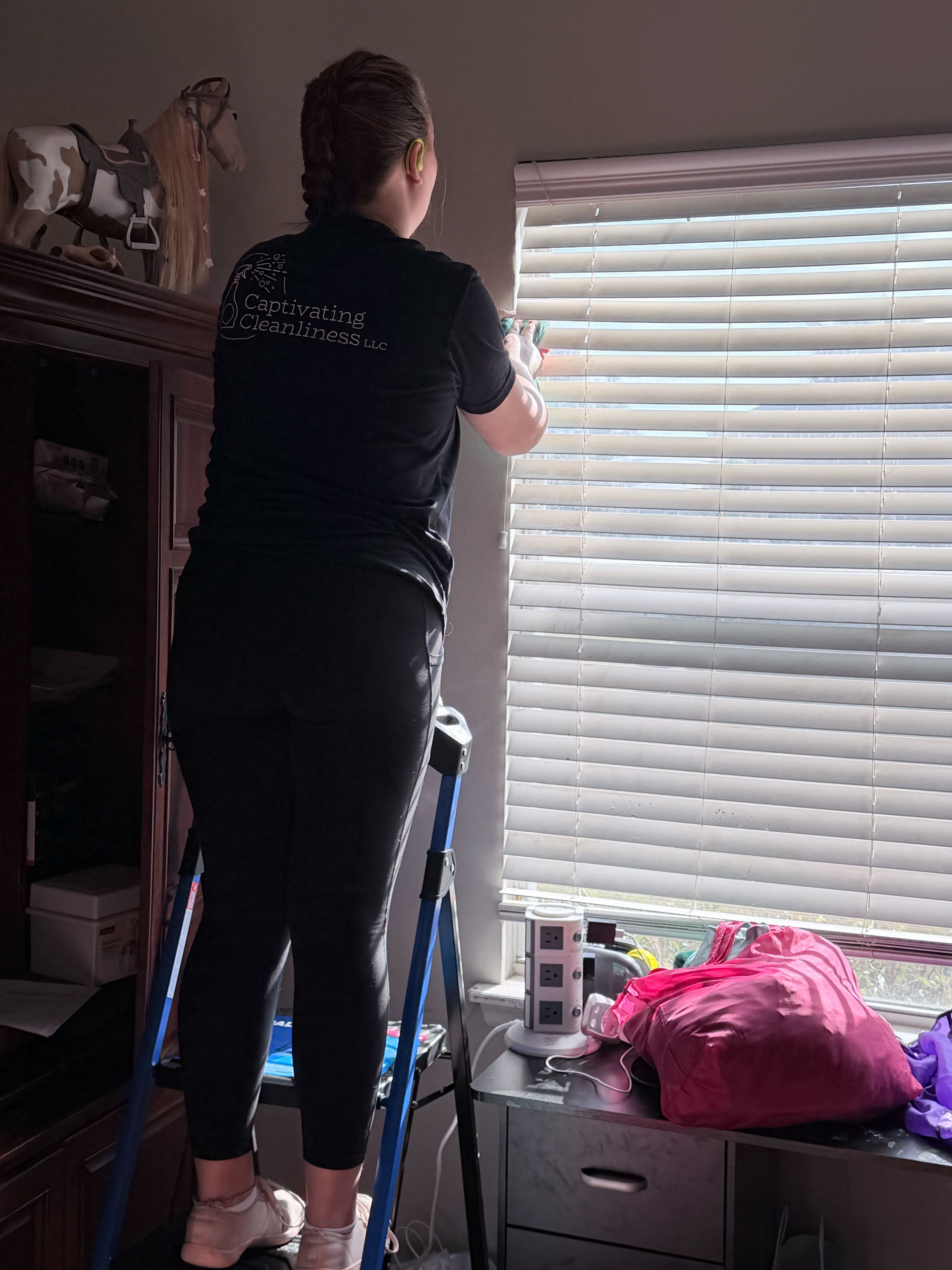 Professional cleaner organizing a closet