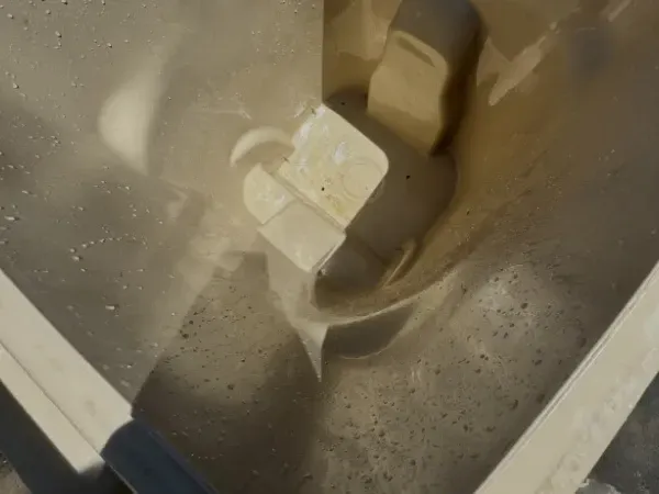 Close-up of a trash bin interior after professional cleaning showing a spotless surface