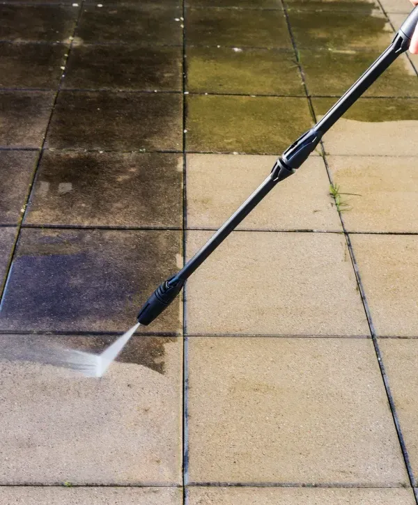 Professional bin cleaning truck sanitizing residential trash cans with eco-friendly system.