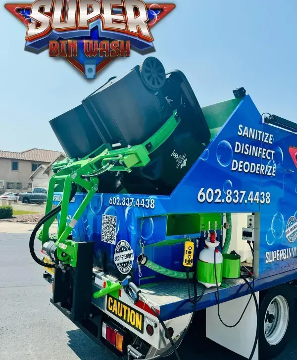 Super Bin Wash truck lifting and cleaning a residential trash bin with onboard sanitation equipment.