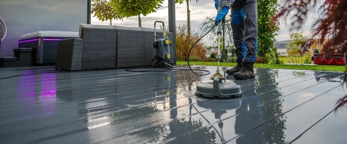 Professional cleaning with pressure washer, showing bright wood contrast.”