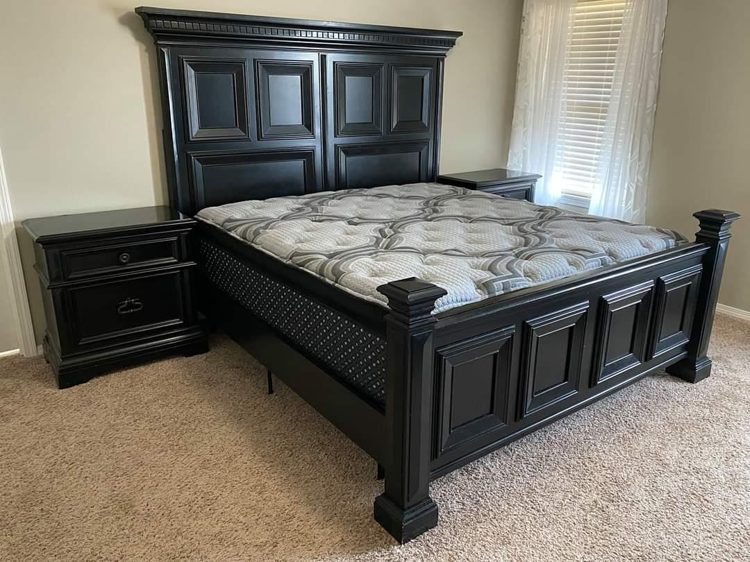 an image of a nice thick black pillow top mattress on a very nice ark colored bedframe