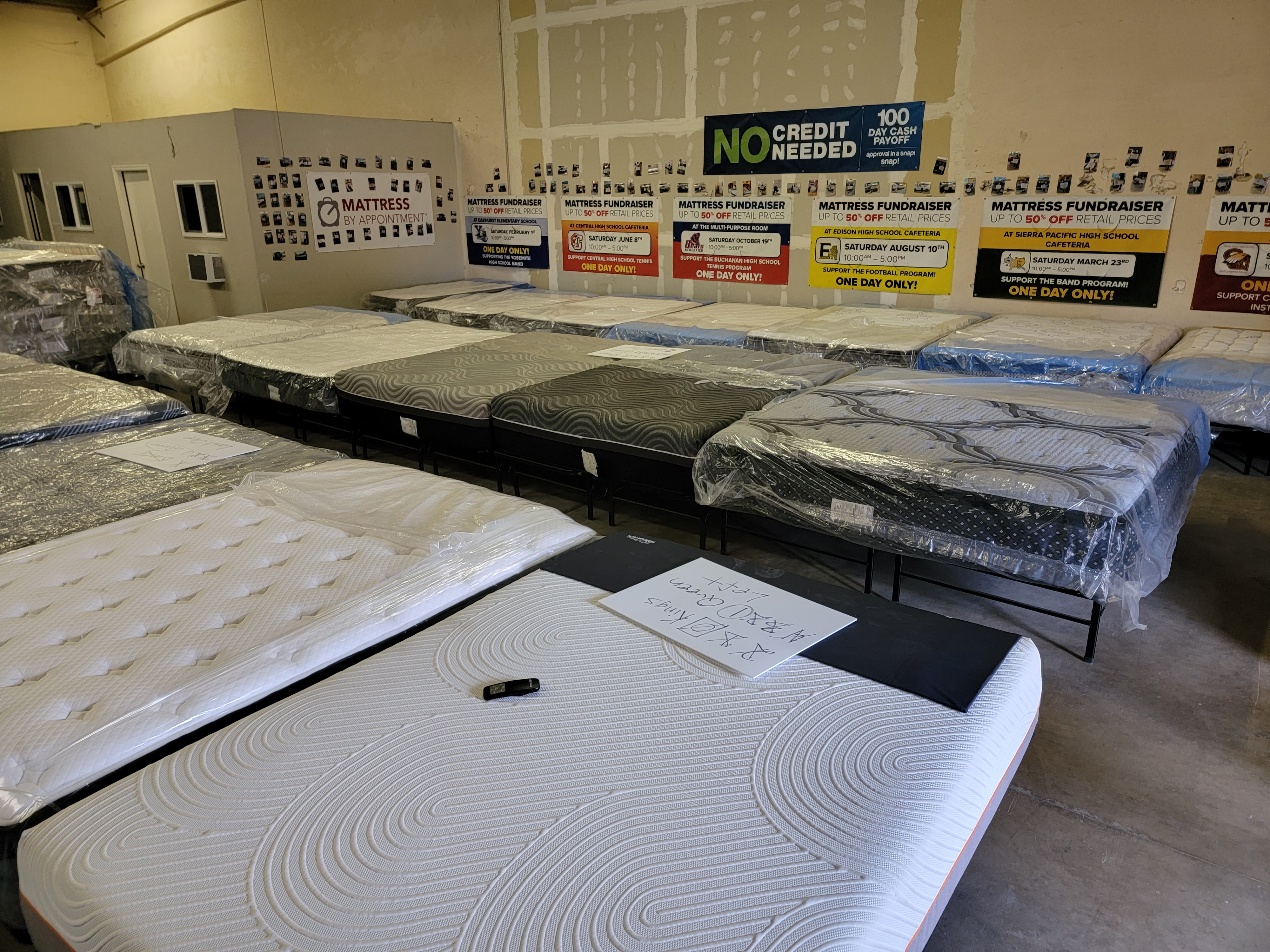 an image of the store owner and his children in the mattress showroom