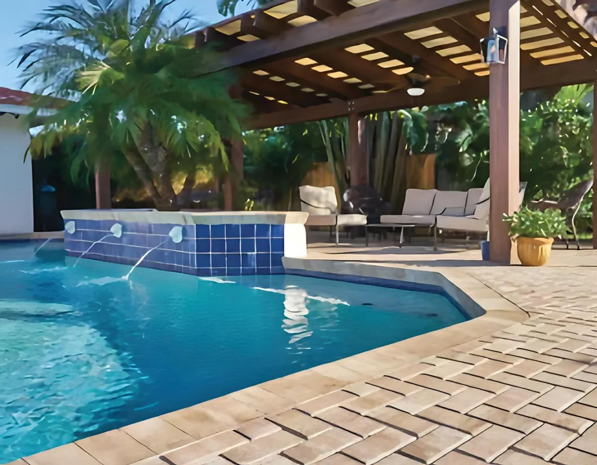 pool deck with outdoor pavers surrounding it