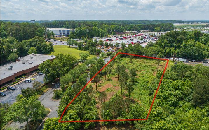 Vacant residential land with survey boundaries marked, ready for private sale evaluation by 590 Holdings