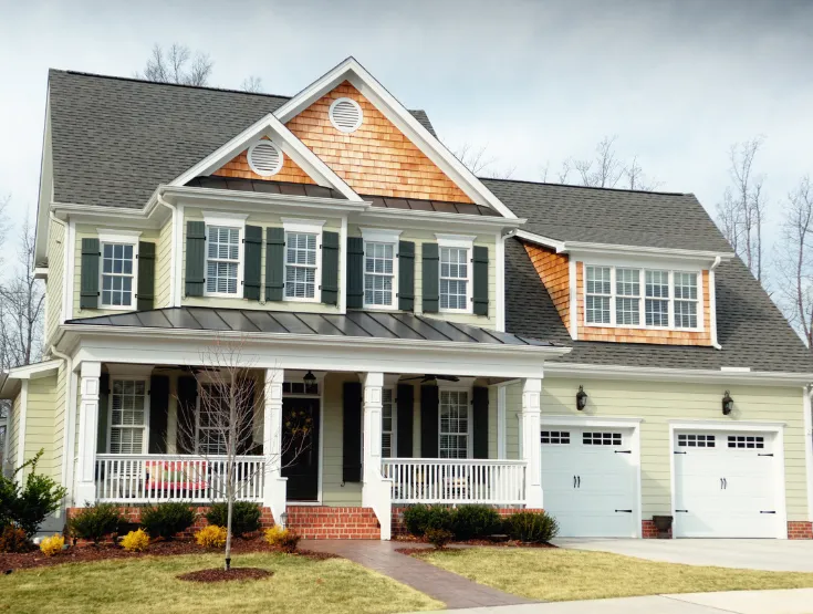 Two story home with seamless exterior addition blending with original design built to expand living space and increase property value
