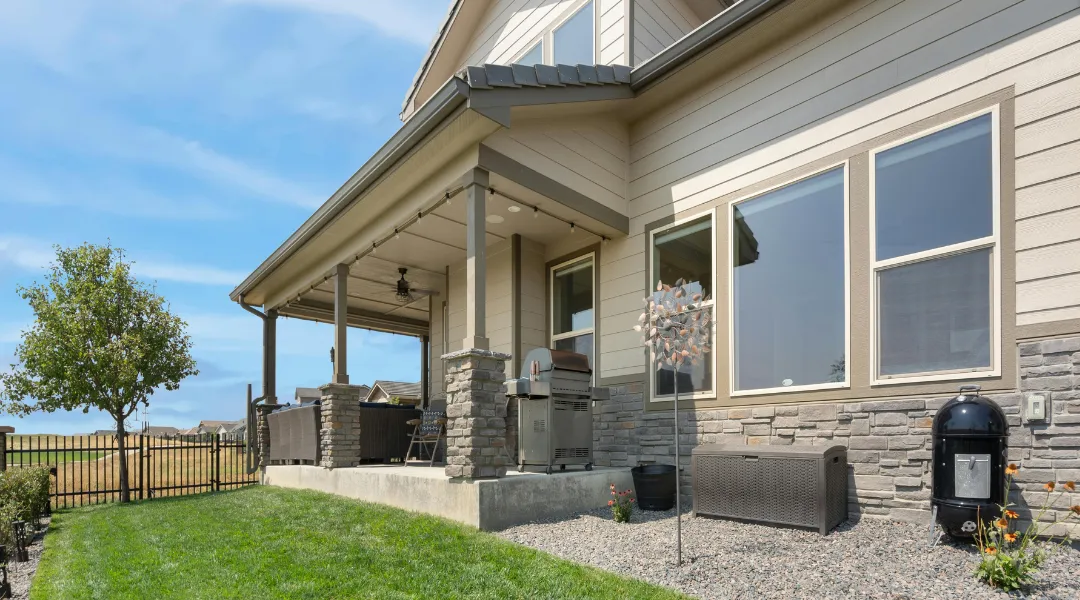 Beautifully renovated home exterior with fresh siding, updated windows, and enhanced curb appeal designed for lasting durability and style.