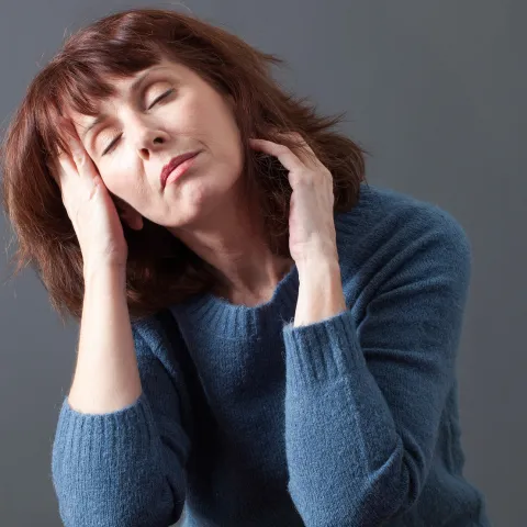 Woman noticing bodily signals and what they mean - systemic overload, environmental stress, nervous system imbalance - keywords: bodily signals, systemic overload.