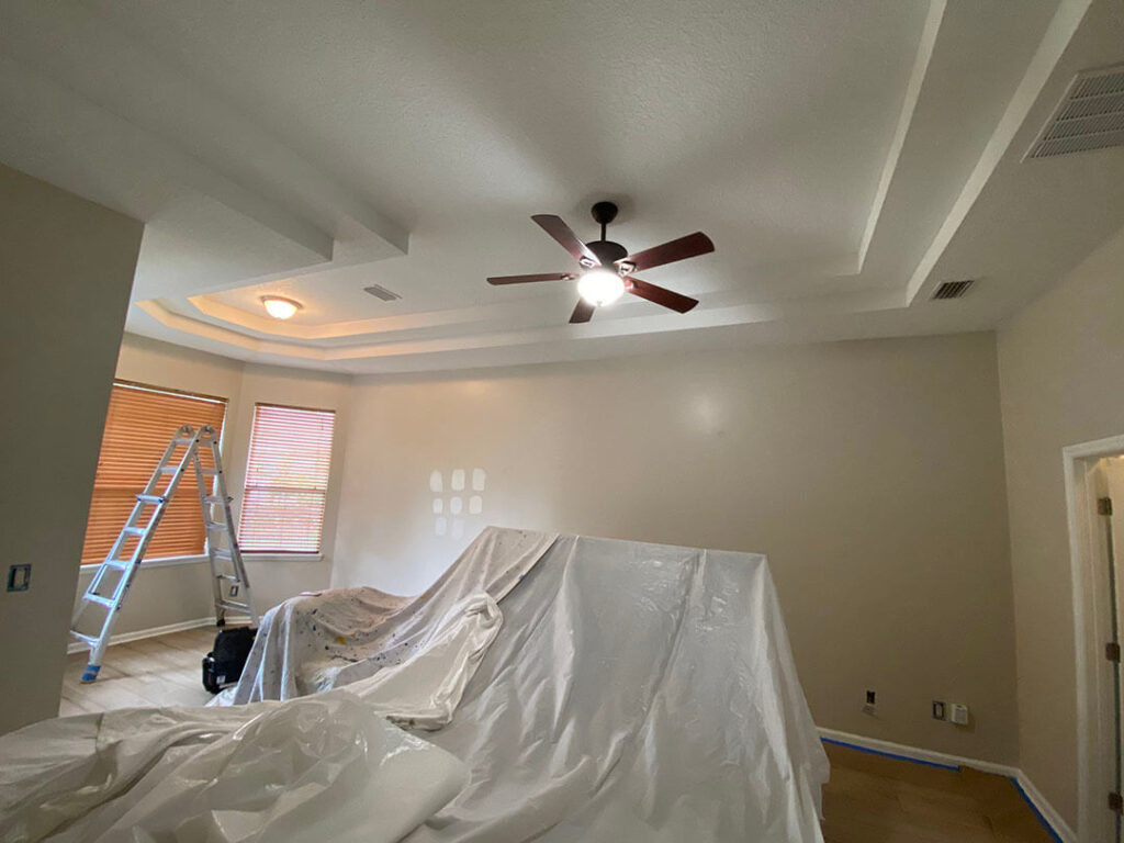 Covering your belongings and making sure that the paint only goes on the wall, not all over the room