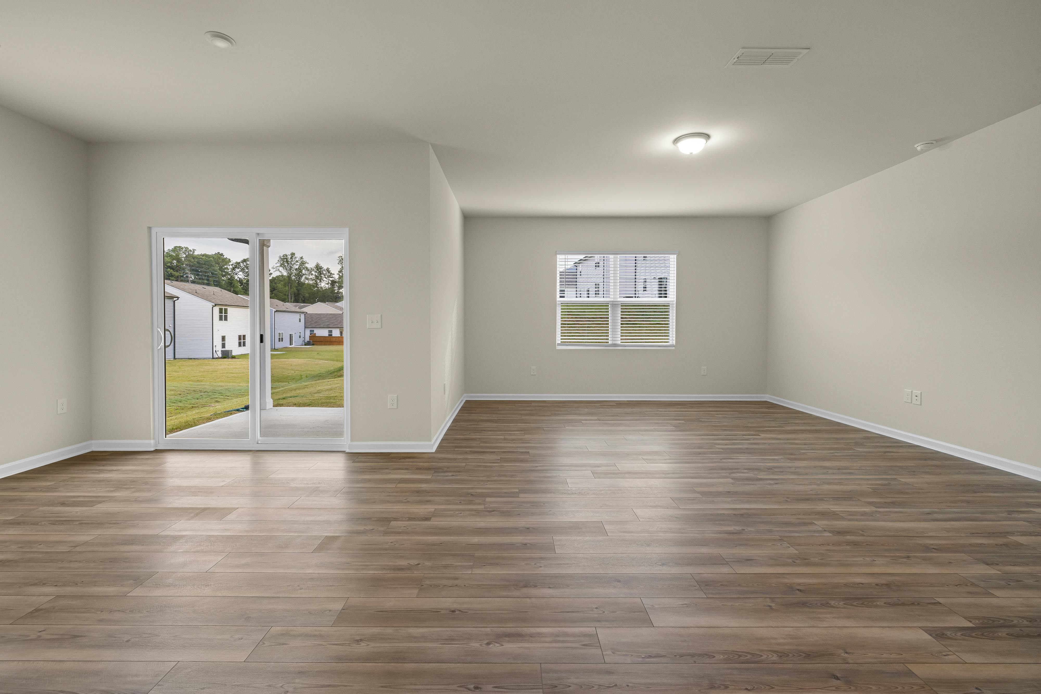 An open concept living room feels bigger and more comfortable with a fresh coat of paint