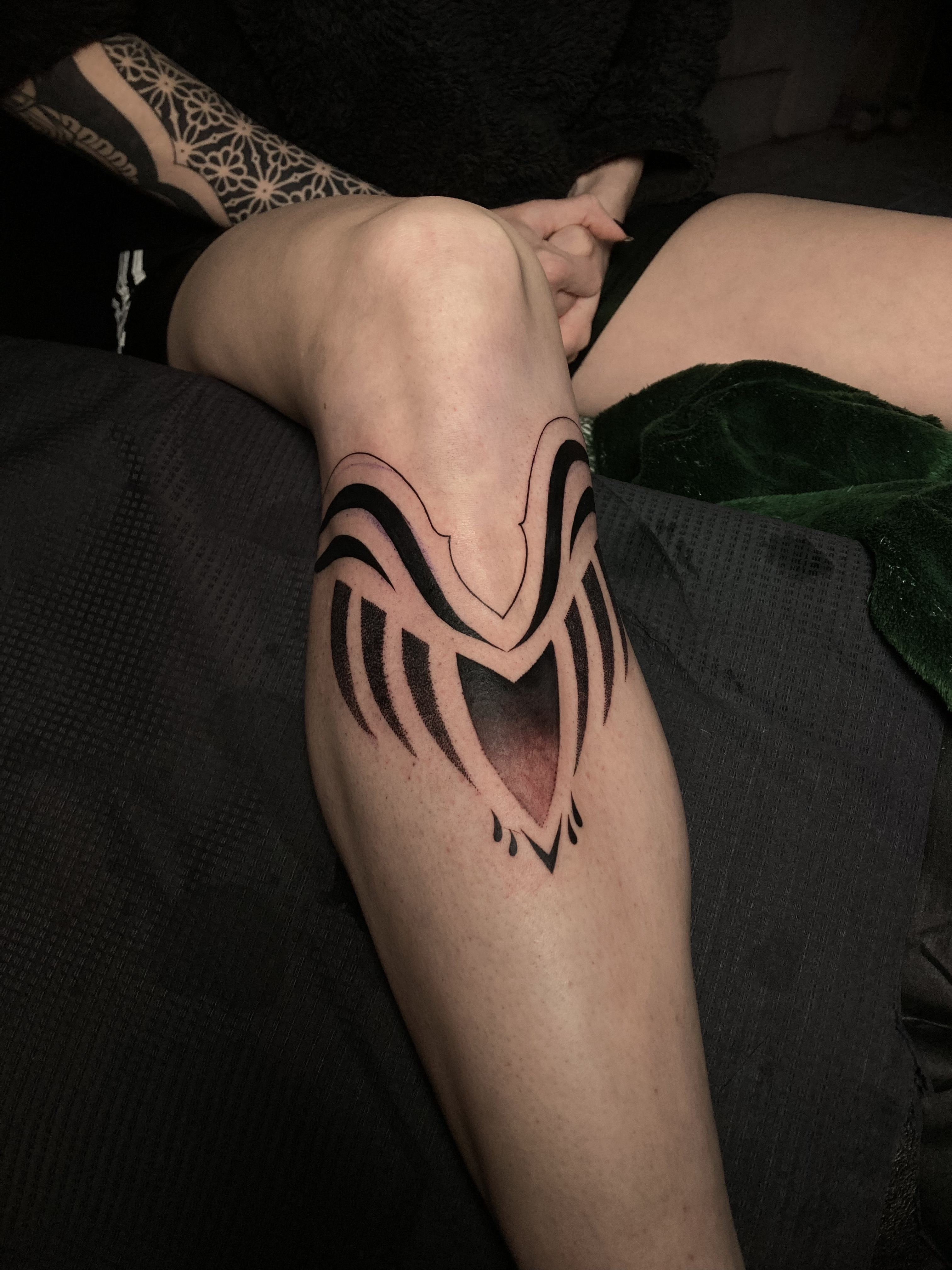 person in blue denim shorts and white nike sneakers standing on gray concrete floor