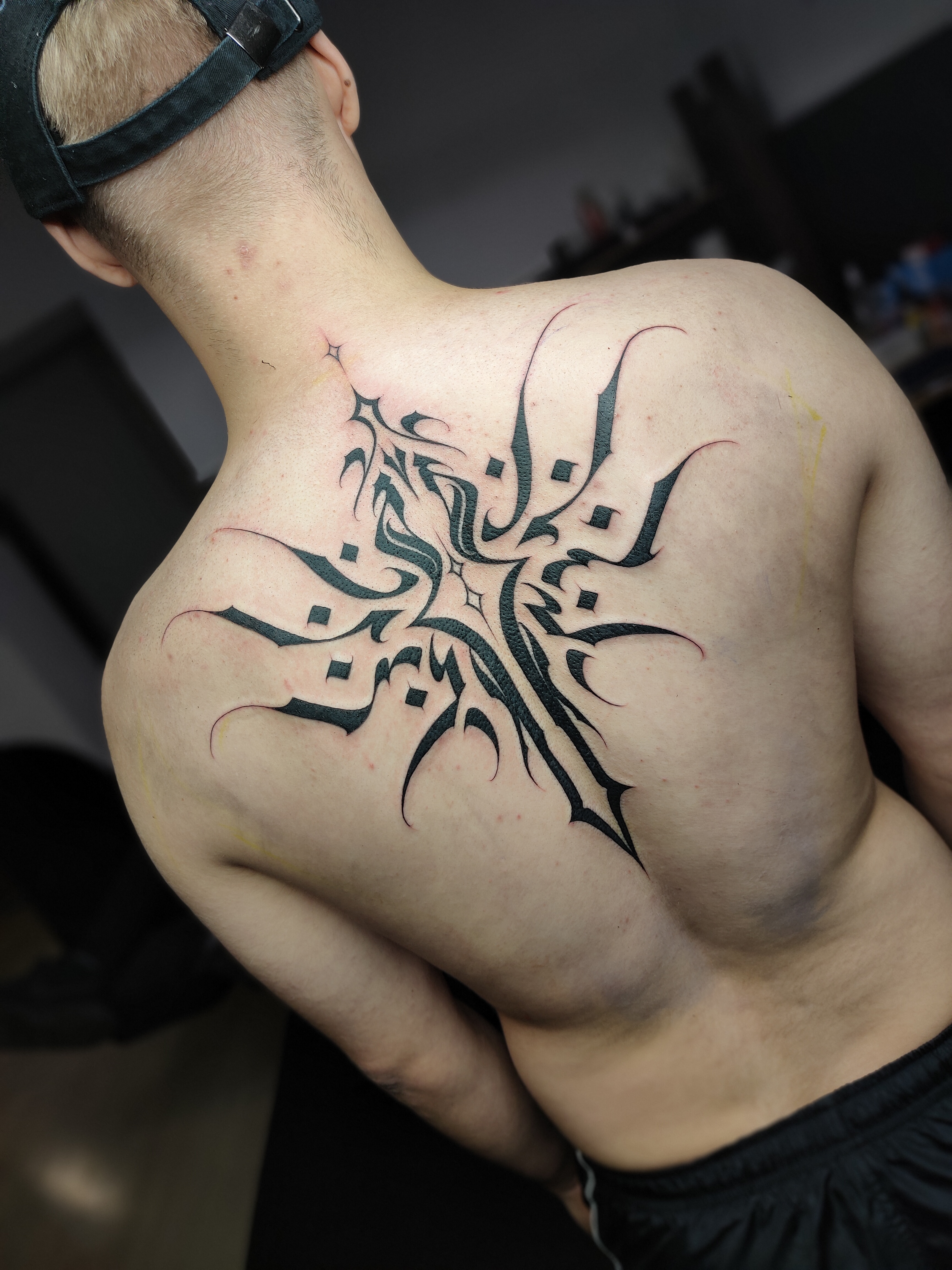 person with tattoo on right arm