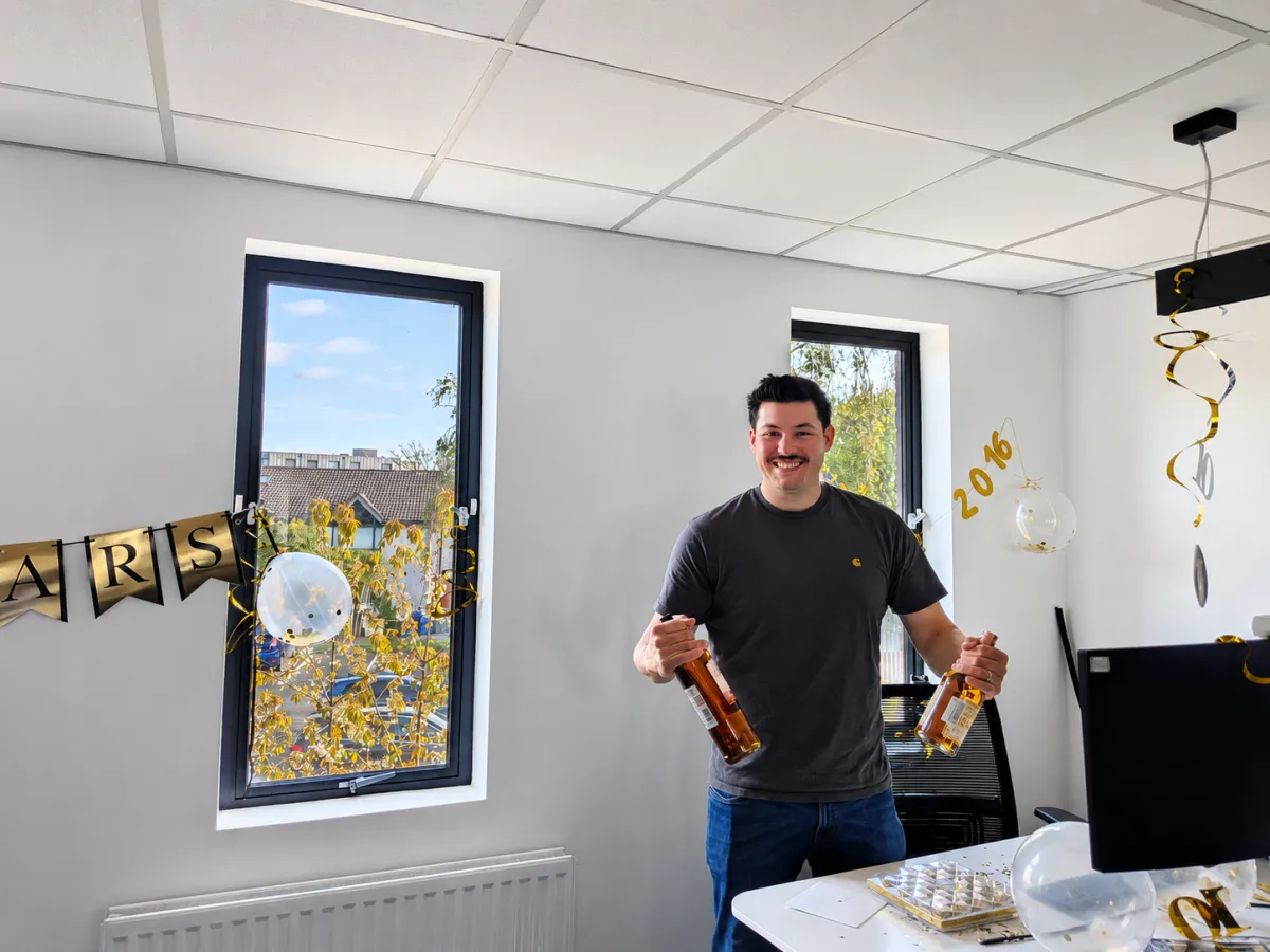 Tom Fairbrother celebrating 10 years with SCC in the office