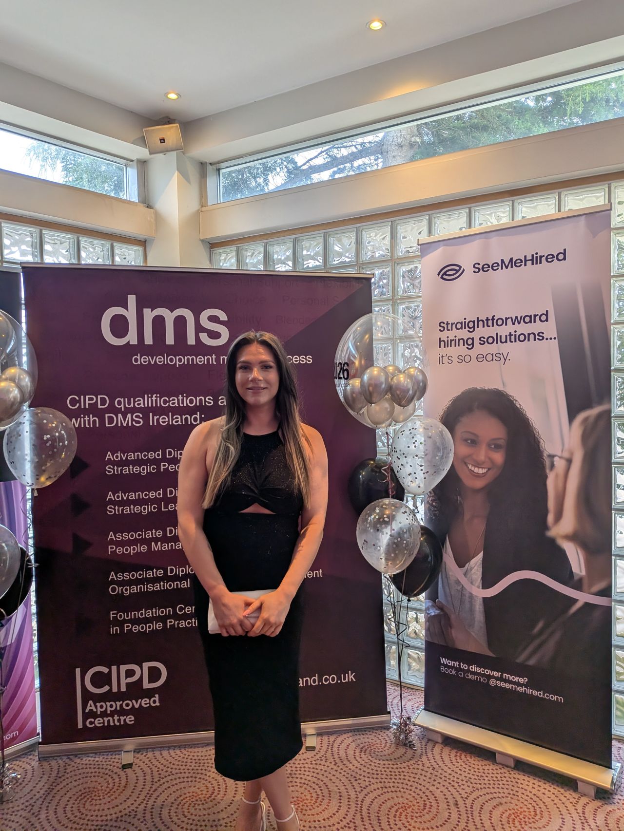 Bethany Clarke receiving her CIPD Associate Diploma in People Management certificate at the Stormont Hotel.