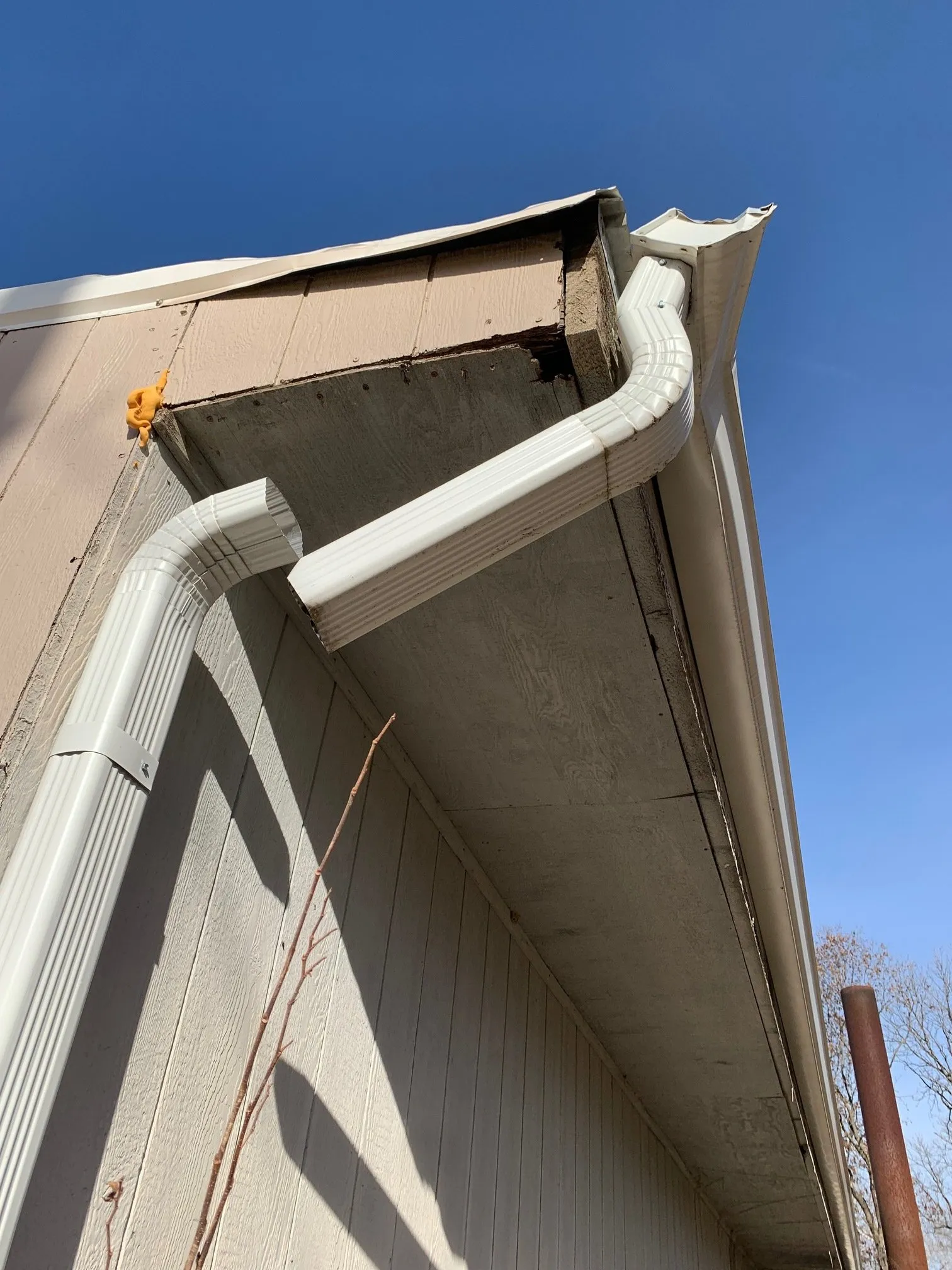 Broken gutter downspout on a commercial building in Albany Ga