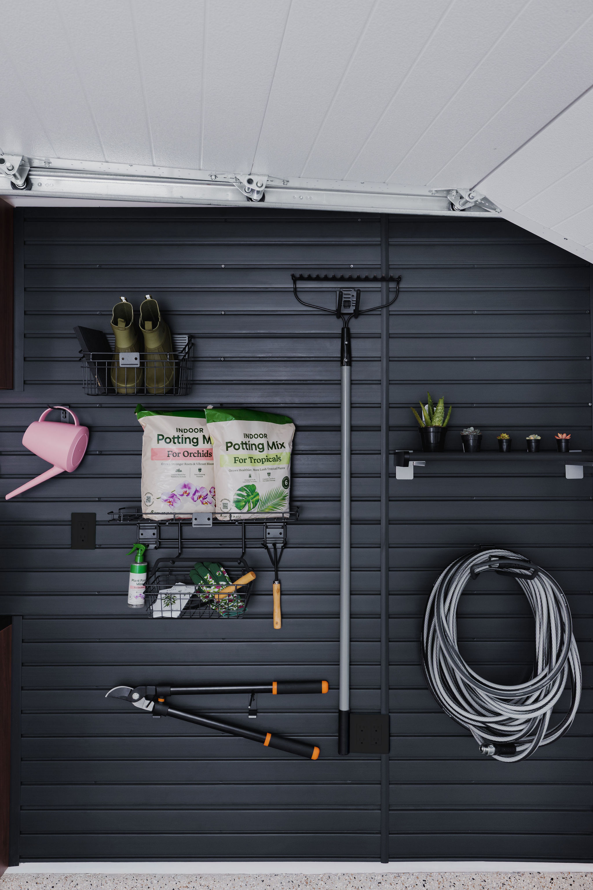 Custom wood grain garage cabinetry and workspace completed in Parkland
