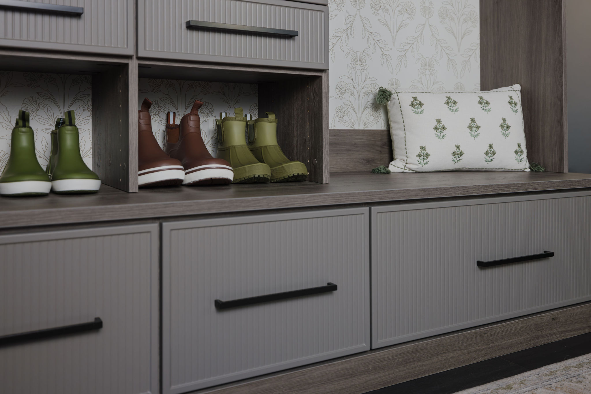 Sleek minimalist ash and grey mudroom storage systems built for a South Florida residence