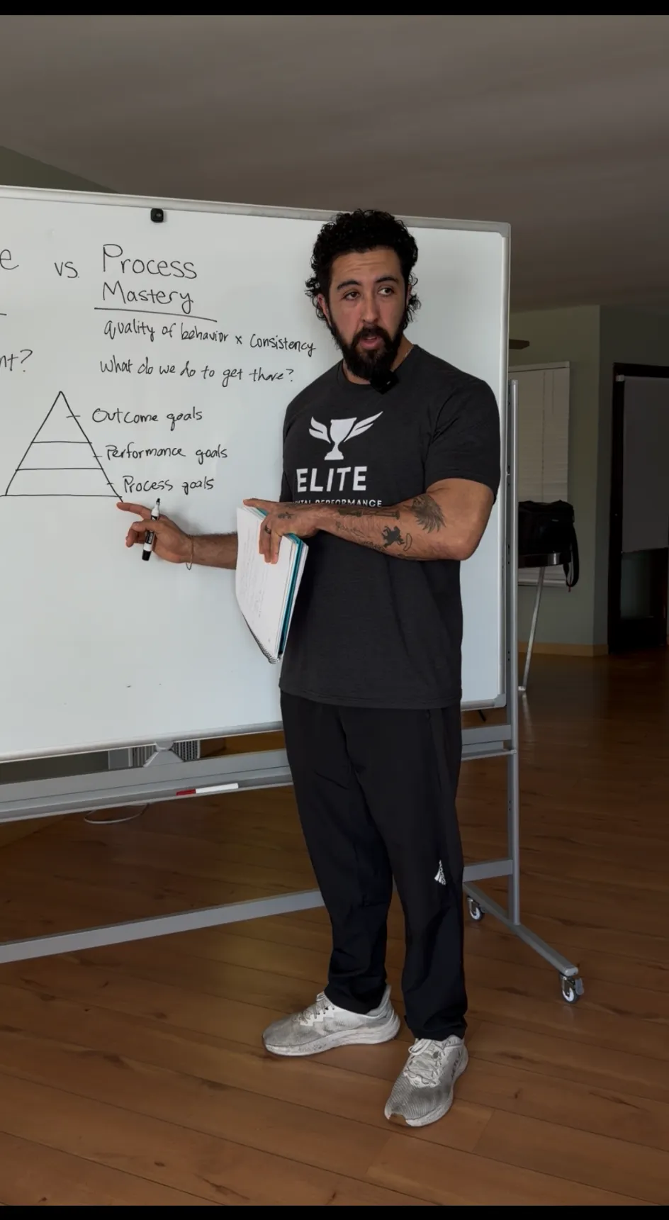 Young girl writing in a book at a table
